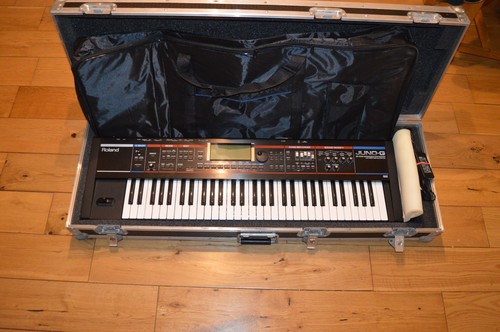 Roland juno synthesiser with - juno,