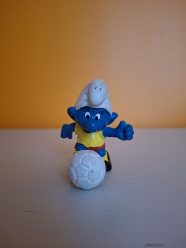 Football playing smurf - football,