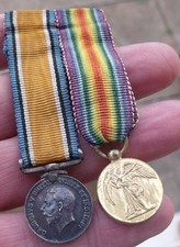 A PERIOD WW1 MINIATURE MEDAL