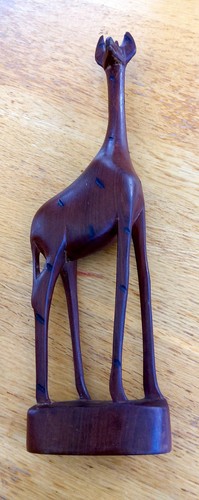 Hand carved wooden giraffe - hand,