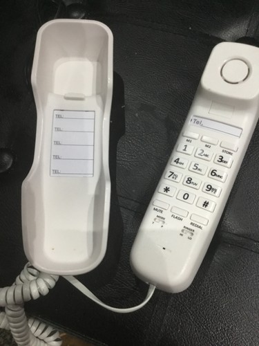 Corded wall mount telephone - wall,