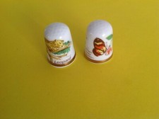 TWO VINTAGE BONE CHINA THIMBLES - ENDANGERED SPECIES FROM THE THIMBLE GUILD