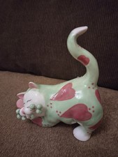 Whimsiclay Cat" figurine designed by Amy Lacombe