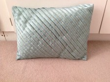 NEXT TEAL RIBBON CUSHION 13 IN BY 17 IN BRILLIANT CONDITION
