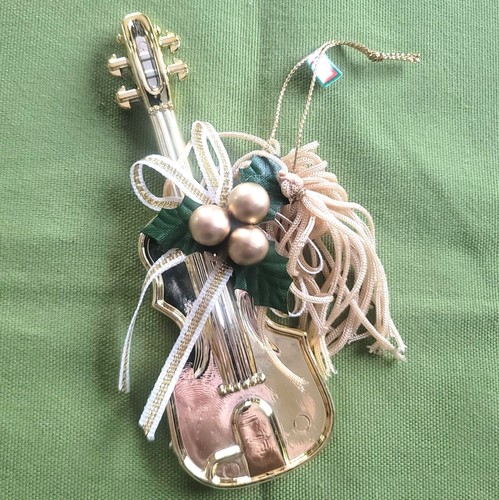 Gold colored guitar hanging - colored,