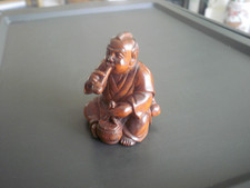 Hand Carved wood netsuke man