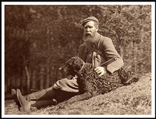 CURLY COATED RETRIEVER MAN GUN