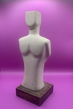 Torso on wooden plinth