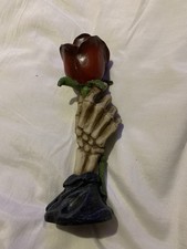Skeleton Hand Holding Rose Tea
