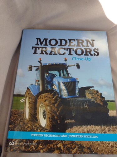 Modern tractors close book - close,