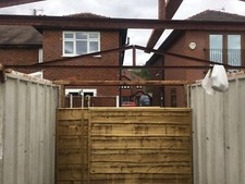 Concrete panel garage. Pebble dash finish. 16ft x 8ft. Rear man access door.