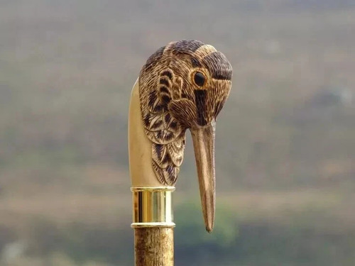 Hand carved bird - hand,