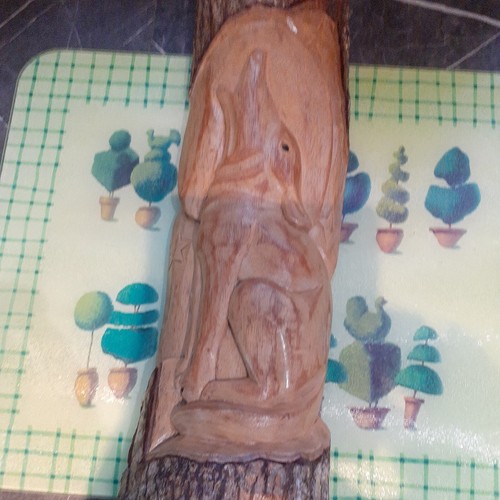 Carved wolf log - in, a