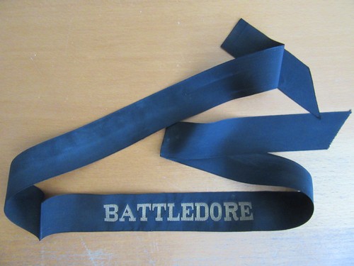 Battledore cap tally - tally,