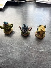 2 Tetley Teapots And 1 Cottage