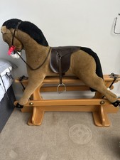 Children’s Brown Rocking Horse. With Saddle And Stirrups