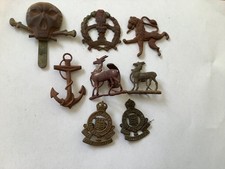 Mixed regimental cap badges and insignia, British army