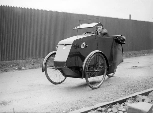 Woman riding three - a, three-wheeler