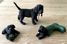 Group of three Collectable Black Labrador Puppy Figurines, (Leonardo?)