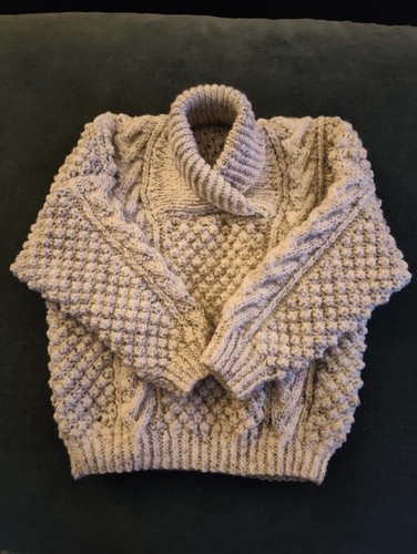 Hand knitted aran child - hand,