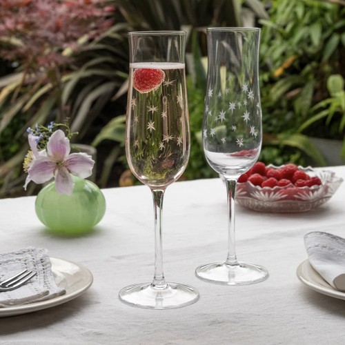 Etched star champagne glasses