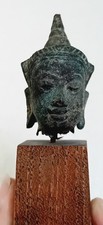 Antique small Thai (Siamese) Buddha bronze head on wooden plinth