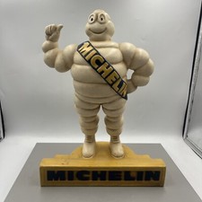 Michelin man on podium.
