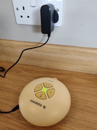 Medela swing pump and adaptor - and,