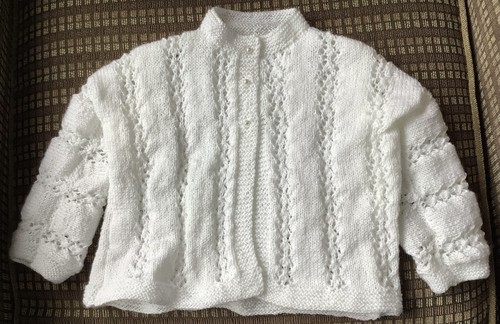 Hand knitted baby - hand,