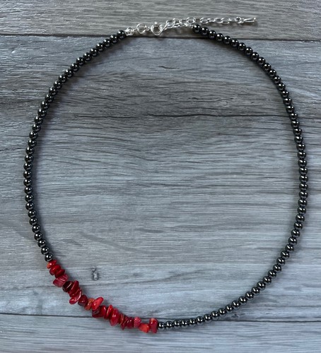 Asymmetric hematite red - &,