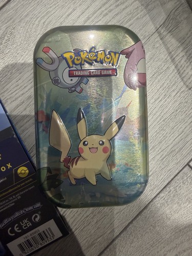 Pokemon trading card tin with - card,