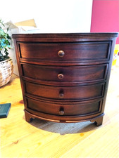 A MINIATURE DARK WOOD BOW FRONT CHEST OF 4 DRAWERS GOOD CONDITION