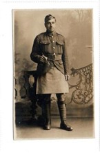 Picture postcard of a WW1 Gordon Highlander (?) with kilt cover (C88910)