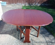 Mahogany drop leaf dining table - length 56" width 40" (when closed width 9")