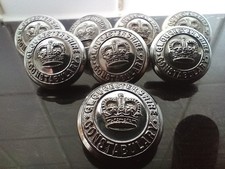 8 matching Gloucestershire Constabulary buttons.