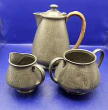 English pewter jugs hammered