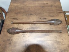 a.vintage pair of wooden indian exercise clubs