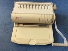 Rexel CB350 report binding machine with A4 plastic comb binders.
