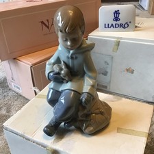 NAO BY LLADRO 1037 BOY WITH RABBIT ON KNEE AND SATCHEL FIGURINE