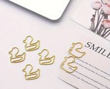 Duck shaped paper clips paper