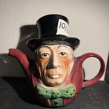A novelty teapot by Tony Wood Staffordshire, the mad hatter, hat has damage.