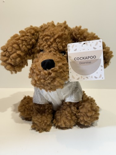 Adorable cockapoo dog - , door