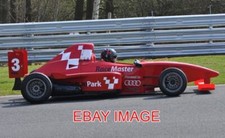 PHOTO  BROKEN DOWN SINGLE SEATER RACING CAR THE DRIVER TRIES HARD TO RESTART THE