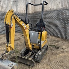 2024 CAT 300.9 Manual coupler with 5 buckets and Brian James Plant Trailer