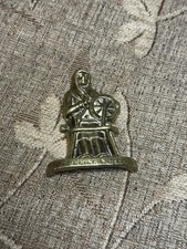 Vintage brass figure with spinning wheel