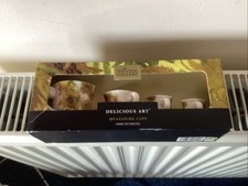 SET OF 4 DECORATIVE CERAMIC MEASURING CUPS