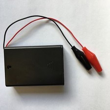 Remote battery holder for