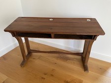 An antique late 19th/early 20th century French double school desk with inkwells