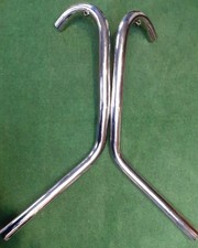 Swept back exhaust pipes for