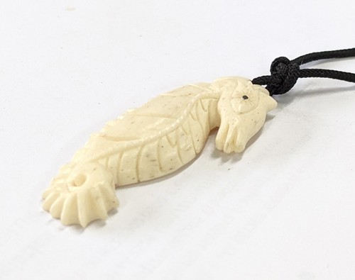 Hand carved seahorse charm - carved,